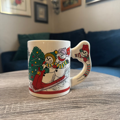 Skiing Snowmen Mug w/ Snowman Handle (Red Toboggan)