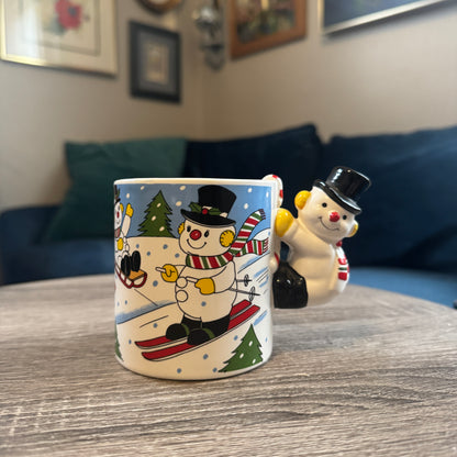 Skiing Snowmen Mug w/ Snowman Handle (Black Hat)