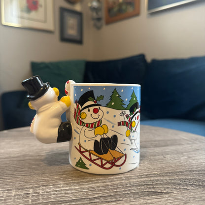 Skiing Snowmen Mug w/ Snowman Handle (Black Hat)
