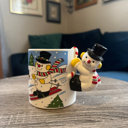 Skiing Snowmen Mug w/ Snowman Handle (Black Hat)
