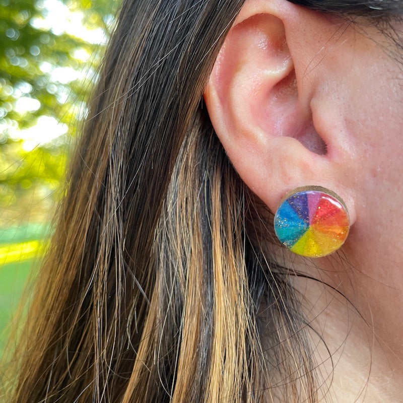 color wheel stud earrings on ear